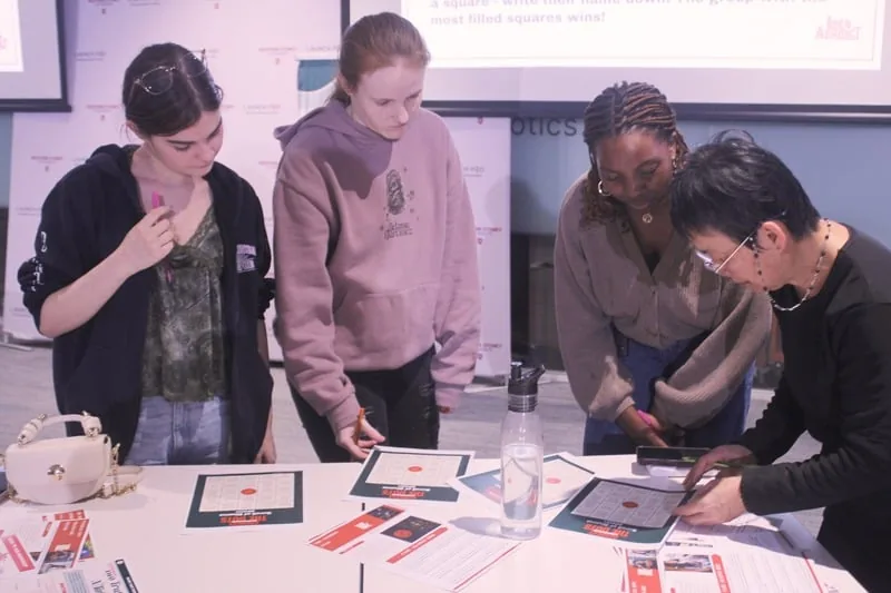 Participants working together at a table during a workshop